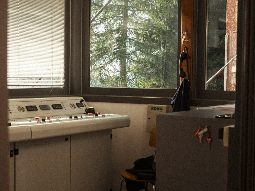 Broadcast control room with mixing console and monitors